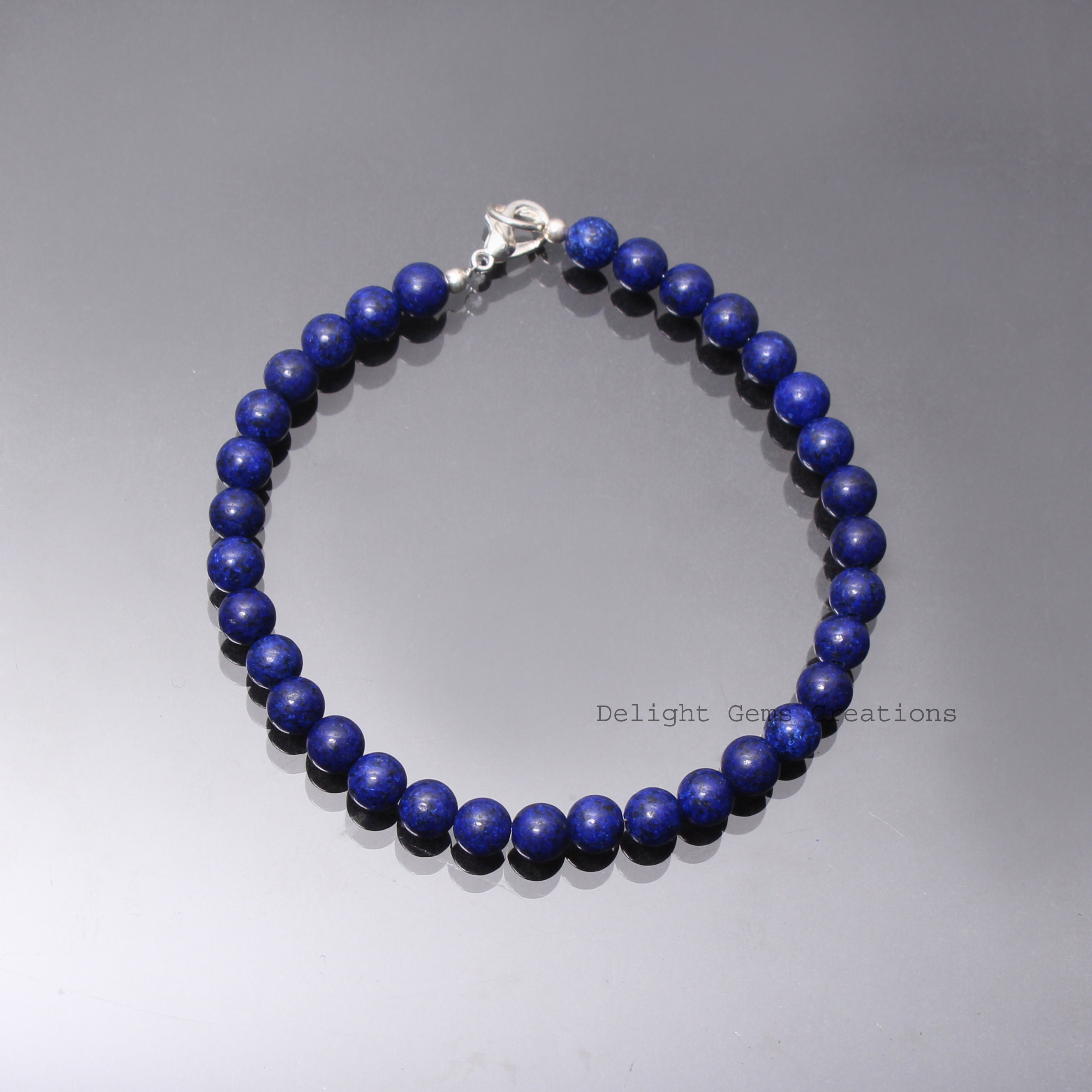 Bracciale Lapislazzuli Grado A con elemento tibetano, elastico, sfere