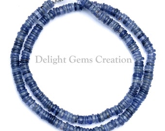 May include: A double strand necklace made of blue gemstone beads. The beads are small and round, and they are strung together on a silver chain. The necklace is approximately 18 inches long.