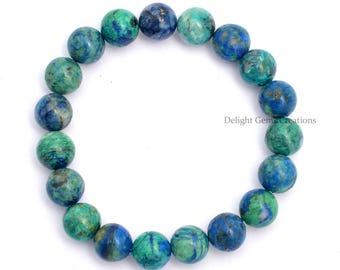May include: A blue and green gemstone bracelet with round beads. The bracelet is made of natural stones and is approximately 8 inches in length.