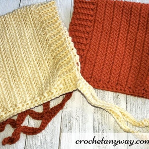 May include: Two crocheted hats, one in a light yellow colour and the other in a burnt orange colour. Both hats have a simple stitch pattern and are tied with long strings.