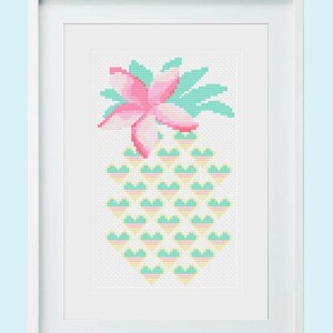 May include: A framed cross-stitch design of a pineapple with a pink flower on top. The pineapple is made of yellow, green, and pink hearts.
