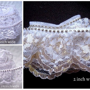 Ruffled Lace, white/silver with beads or white gold with beads selling by the yard