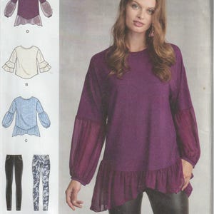 May include: Simplicity sewing pattern featuring a purple top with sheer sleeves and a ruffled hem. The pattern includes variations and options for different styles of tops and pants. The image also shows a woman wearing the purple top.