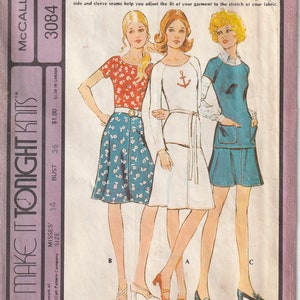May include: Vintage McCall's sewing pattern envelope featuring three women's separates. The designs include a floral print skirt and top, a white dress with an anchor detail, and a blue dress with pockets. The envelope has text that reads "Make It Tonight Knits".