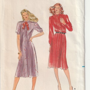 May include: A vintage sewing pattern for a dress with a button-up front and a bow at the neck. The pattern is for size 8 and is from Butterick, pattern number 3323. The price is $2.25.