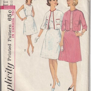 May include: Vintage Simplicity sewing pattern 5329 featuring three dress designs. The pattern includes a sleeveless dress, a dress with a jacket, and a pink dress with a matching jacket. The pattern is for a junior size 13 with a 33-inch bust.