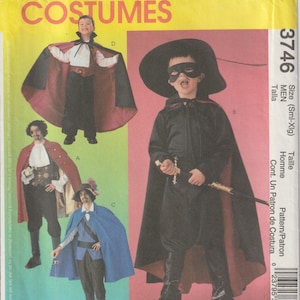 May include: A vintage McCall's Costumes pattern envelope featuring illustrations of various men's costumes. The envelope is yellow with the text "McCall's Costumes" at the top. The costumes include a vampire, a musketeer, and a Zorro-like character.