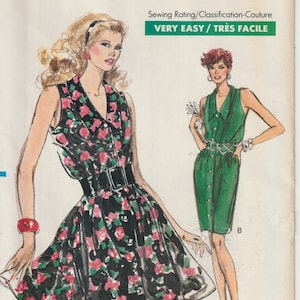 Könnte beinhalten: Ein Schnittmuster für zwei ärmellose Kleider. Das Kleid links ist schwarz mit einem Blumendruck und einem schwarzen Gürtel. Das Kleid rechts ist grün mit einer Knopfleiste vorne und einem weißen Gürtel. Das Schnittmuster ist mit "Very Easy Very Vogue" beschriftet und die Größe ist 14-16-18.