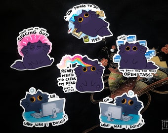 May include: A collection of whimsical stickers featuring a cartoon cat in various poses. The cat is depicted with expressions like spacing out, overwhelmed with tasks, and struggling with too many open tabs. The stickers have text like "What was I doing?"