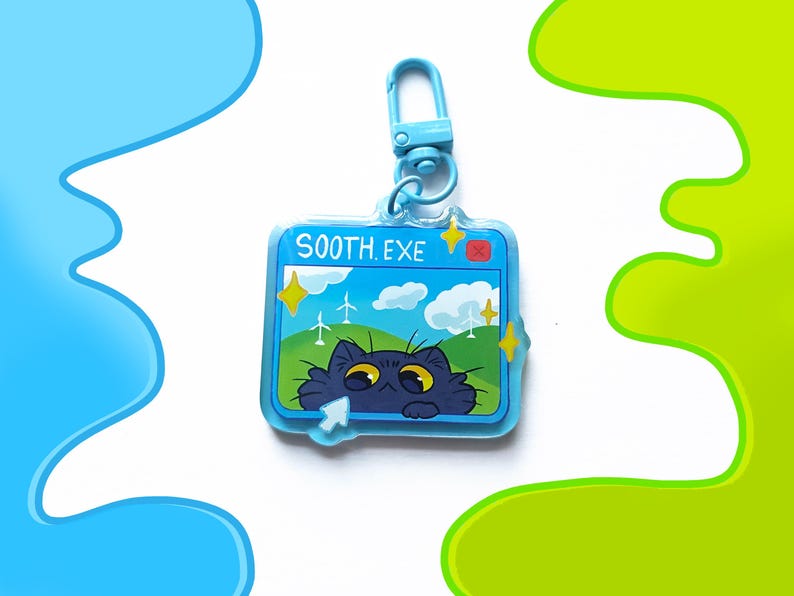May include: A blue acrylic keychain with a cartoon cat peeking out from a computer screen. The screen displays a blue sky with clouds, windmills, and the text "SOOTH.EXE". The keychain has a blue clasp.