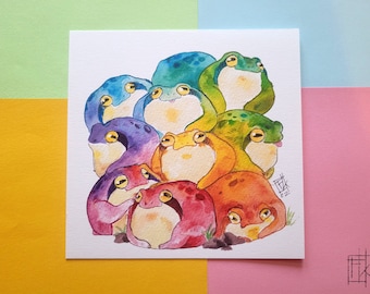 May include: A watercolor painting of a group of frogs, each painted in a different color of the rainbow. The frogs are arranged in a circle, with their heads facing the center. The painting is signed "Eik" and dated "22."