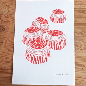 May include: A red and white print of five chocolate mallow candy wrappers. The wrappers are stacked on top of each other and have a star design. The text on the wrappers reads "Milk Chocolate Mallow" and "Dunhill Milk Chocolate". The print is signed "Stenhand 45/250".