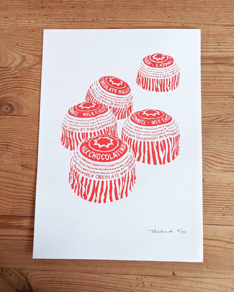 May include: A red and white print of five chocolate mallow candy wrappers. The wrappers are stacked on top of each other and have a star design. The text on the wrappers reads "Milk Chocolate Mallow" and "Dunhill Milk Chocolate". The print is signed "Stenhand 45/250".