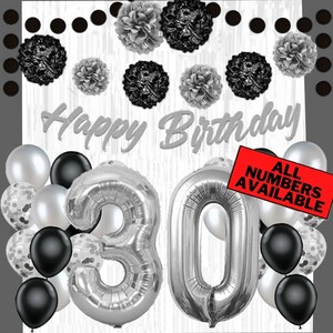 May include: Black and silver birthday decorations with silver number balloons that spell out "30". The background is a white woodgrain pattern with black polka dots. The text "Happy Birthday" is written in silver script. A red banner reads "All Numbers Available".