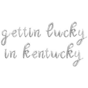May include: Silver foil balloon letters spelling "gettin lucky in kentucky".
