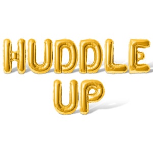 May include: Gold foil balloons spelling out "HUDDLE UP" against a white background.
