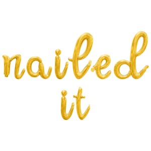 May include: Gold foil letters spelling "nailed it" in a cursive font.