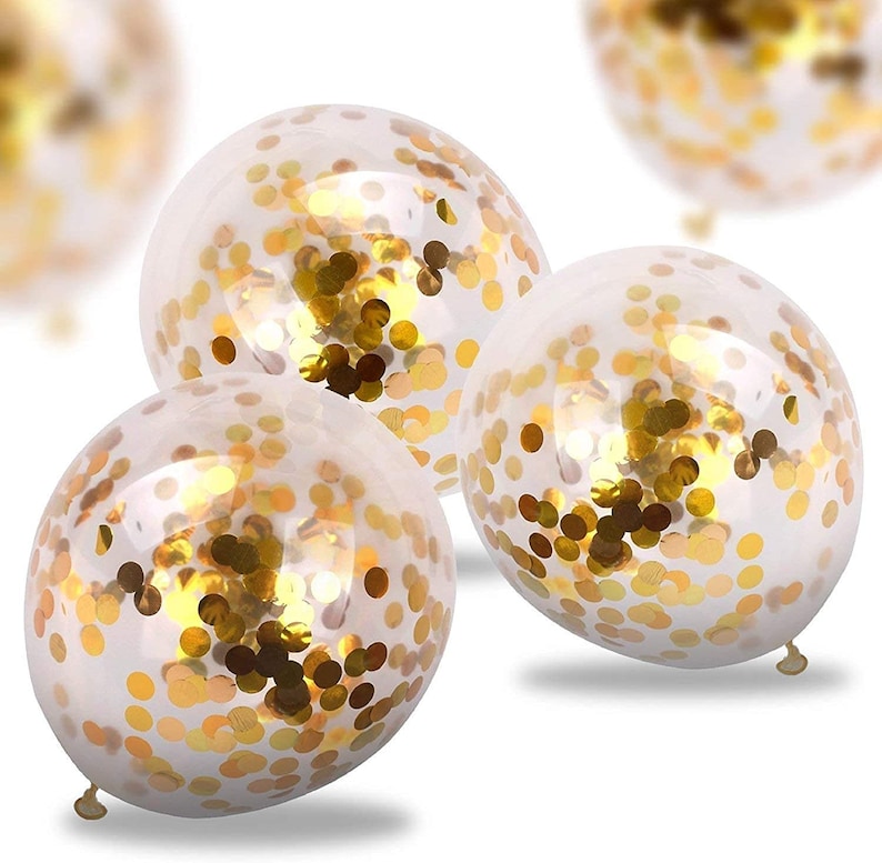 May include: Three clear balloons filled with gold confetti. The balloons are round and have a shiny finish.