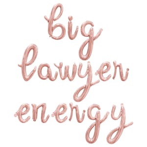 May include: Rose gold foil balloons spelling out "big lawyer energy" in a cursive font. The balloons are inflated and arranged on a white background. Ideal for a graduation or law school celebration.