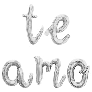 May include: Silver foil balloons spelling out "te amo" in cursive script.