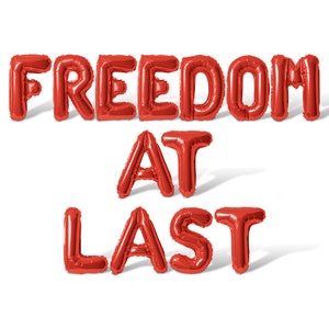 May include: Red balloon letters spelling out the phrase "Freedom at Last".