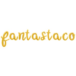May include: Gold-colored script text spelling out "fantastaco" on a white background. The letters appear to be inflated, possibly balloons or a similar material, with a slight sheen.