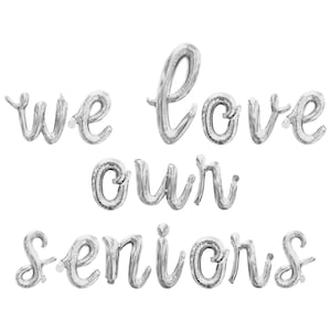 May include: Silver balloon letters spelling out "We love our seniors".