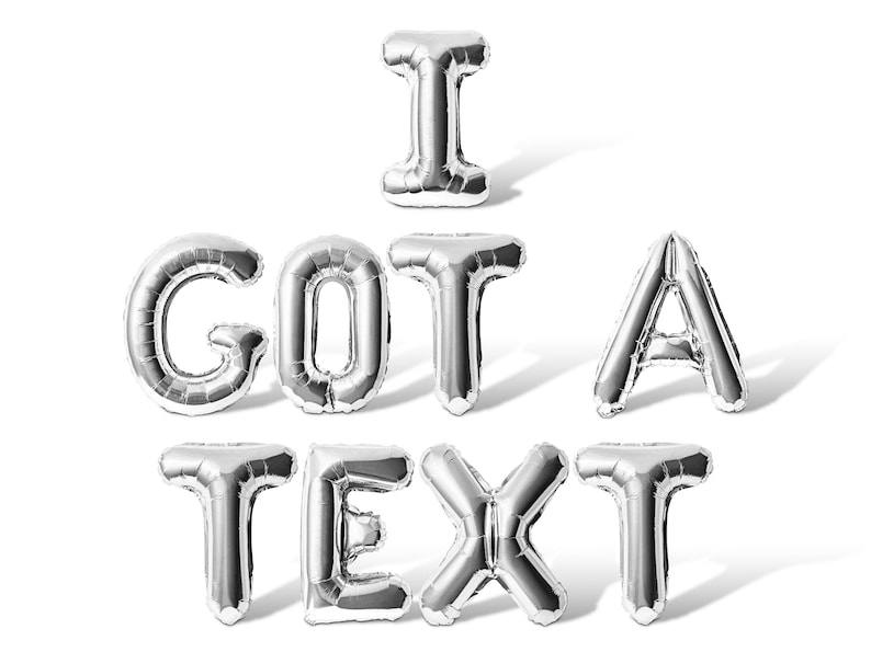 May include: Silver letter balloons spelling out the phrase "I got a text".