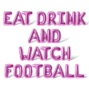 May include: Pink foil balloons spelling out "Eat Drink And Watch Football" on a white background.