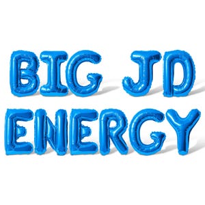 May include: Blue foil balloons spelling out "BIG JD ENERGY" on a white background. The letters are inflated and have a shiny appearance, casting shadows. The overall theme is celebratory.
