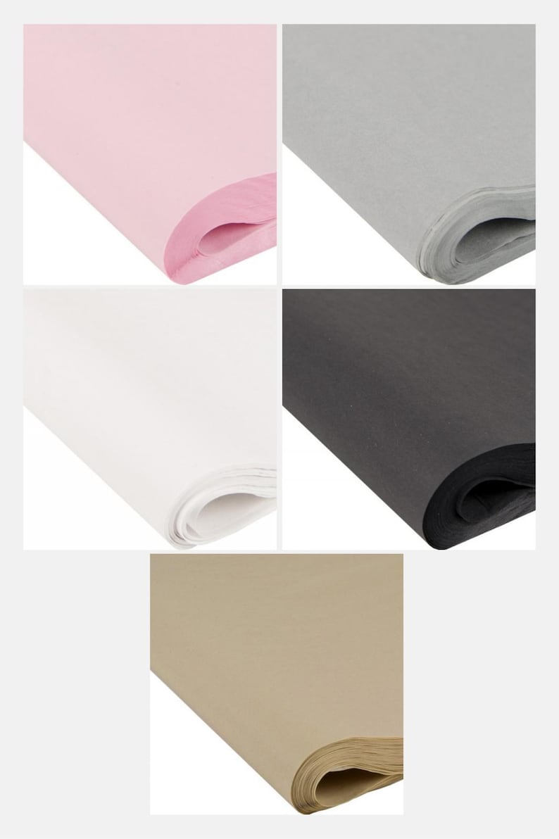 May include: Assortment of tissue paper in various colors. The image displays rolls of pink, gray, white, black, and tan tissue paper. The paper is neatly rolled, showcasing the different colors and textures.