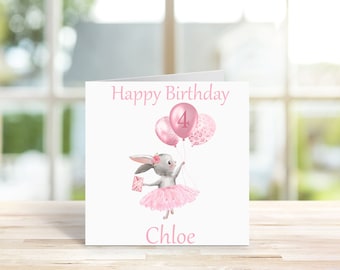 May include: A pink birthday card with a gray bunny wearing a pink tutu and holding pink balloons. The card says "Happy Birthday" and "Chloe" and has the number "4" on one of the balloons.