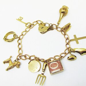 Gold Charm Bracelet with 11 Gold Charms  and Heart Shaped Lock (836)