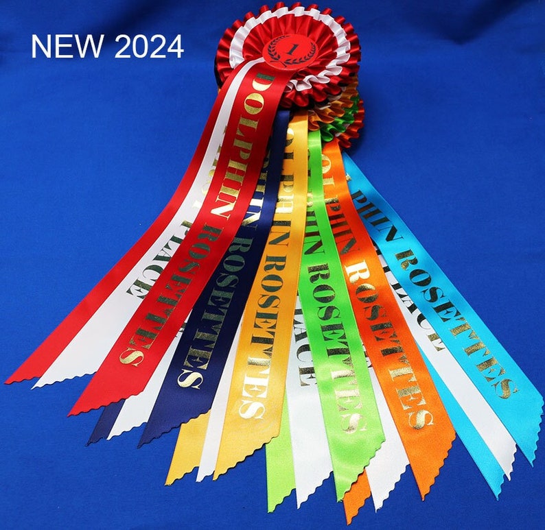 3-tier vibrant rosettes. Wide 15in long printed tails finished to point design, 50mm centres with Laurel place motif. All sports and events. image 1