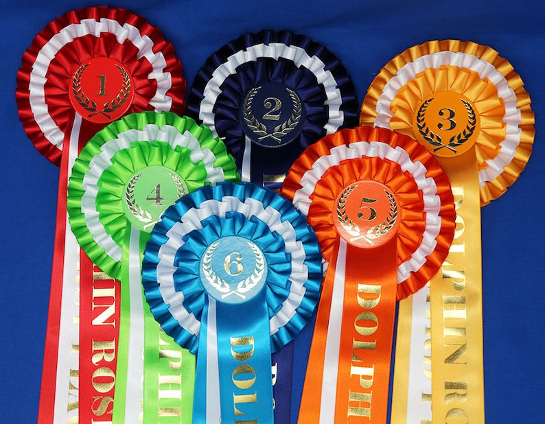 3-tier vibrant rosettes. Wide 15in long printed tails finished to point design, 50mm centres with Laurel place motif. All sports and events. image 3