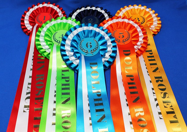 3-tier vibrant rosettes. Wide 15in long printed tails finished to point design, 50mm centres with Laurel place motif. All sports and events. image 2