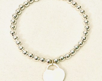 Silver plated beaded bracelet with heart charm