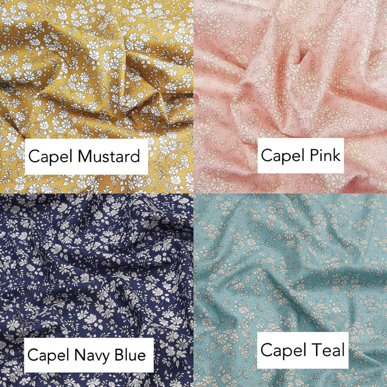 May include: Four fabric swatches with a white floral pattern on different colored backgrounds: mustard yellow, pink, navy blue, and teal.