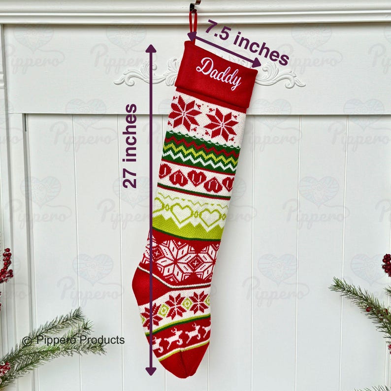 May include: Red and white knitted Christmas stocking with a green, white, and red pattern. The stocking is 27 inches long and 7.5 inches wide. The top of the stocking is red and has the word "Daddy" embroidered on it.