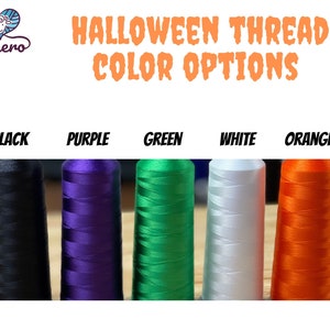 May include: Image of Halloween thread color options. The image displays five spools of thread in black, purple, green, white, and orange. The text "Halloween Thread Color Options" is written in orange, with the brand logo in the upper left corner.