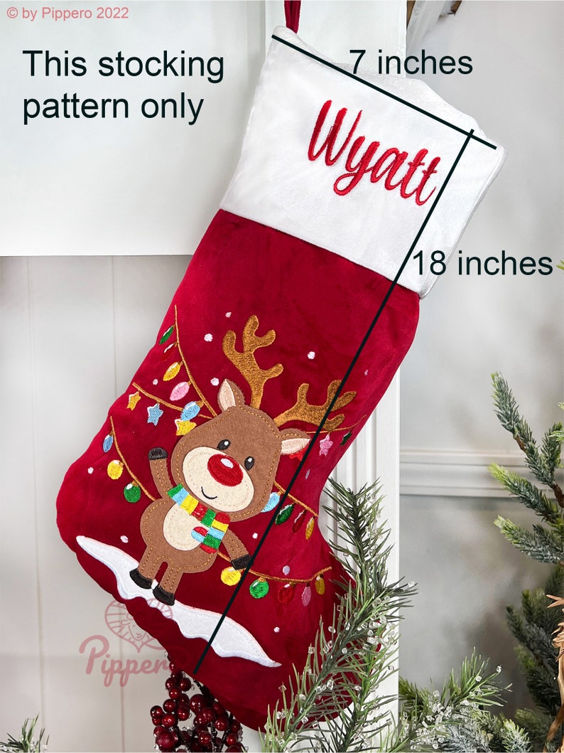 May include: Red and white Christmas stocking with a reindeer and lights design. The stocking is 18 inches long and 7 inches wide. The name Wyatt is embroidered on the stocking.