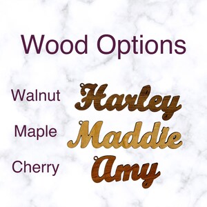 May include: Three wood samples showing different wood types: walnut, maple, and cherry. The wood samples are cut into the shape of names, "Harley", "Maddie", and "Amy".