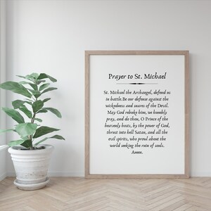 May include: A black and white printable wall art print with a prayer to Saint Michael. The text reads "Prayer to St. Michael" and includes the prayer in English.