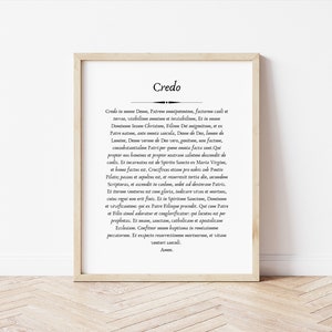 May include: A framed print with the word "Credo" in a large font at the top. The text below is in a smaller font and is a religious text in Latin.