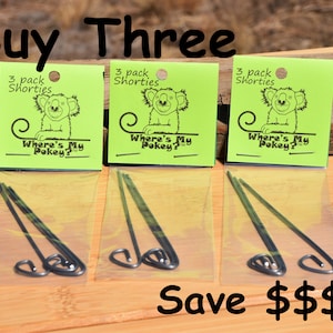 May include: Three packages of black metal pokey sticks with green and yellow packaging. The packaging features a cartoon koala and the text "Where's My Pokey?" and "3 pack Shorties". The text "Buy Three Save $$$" is at the bottom of the image.