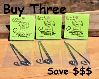 May include: Three packages of black metal pokey sticks with green and yellow packaging. The packaging features a cartoon koala and the text "Where's My Pokey?" and "3 pack Shorties". The text "Buy Three Save $$$" is at the bottom of the image.