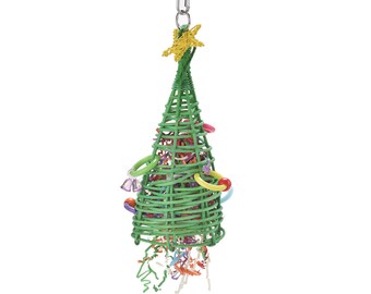 May include: A green wicker Christmas tree toy for birds. The tree is decorated with colorful rings, bells, and streamers. It has a yellow star on top and a metal hook for hanging.