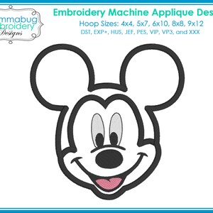 May include: An embroidery machine applique design featuring a smiling cartoon mouse face with large ears, outlined in black. The design includes the text "Embroidery Machine Applique Design" and "Mommabug Embroidery Designs". Hoop sizes are listed.
