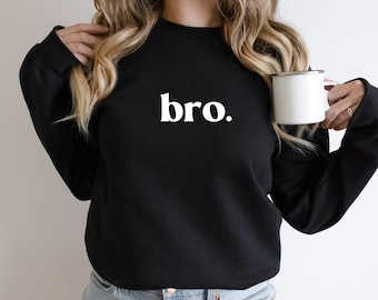May include: Black sweatshirt with the word "bro." printed in white on the front.