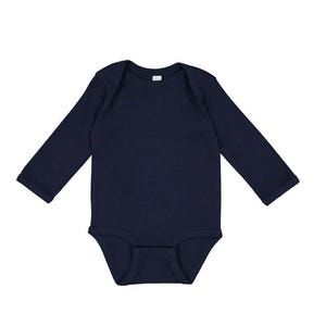May include: A navy blue long-sleeved baby bodysuit.
